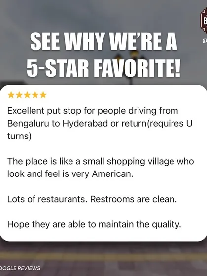 A customer review describing our look and feel as a "small shopping village" with an American vibe, praising the clean restrooms and variety of restaurants.