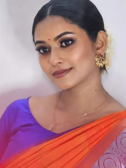A close-up of my self-makeup look, showing the beautiful color combination of the saree and the makeup.
