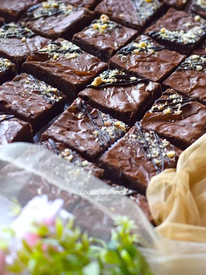 A batch of my classic fudgy brownies, ready to be packed. These are rich and sturdy, which is why they are a popular choice for sending as gifts, even to other cities.
