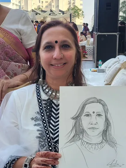It's always a joy to draw guests who are so full of life. This quick charcoal sketch captures her warm smile. These portraits become great conversation starters during the event.