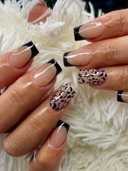 Wild meets classy. This set combines sharp, black French tips with a statement leopard print accent nail for a look that's both chic and fierce.