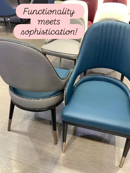 Functionality meets sophistication in these modern dining chairs. The design features a mix of textures, with a smooth blue leatherette front and a textured grey fabric back, all tied together with elegant metal-tipped legs.