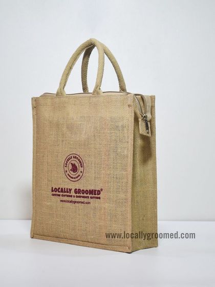 Our classic jute tote bag, branded with the Locally Groomed logo. This demonstrates the quality and simplicity of our eco-friendly bag options, which can be fully customized.