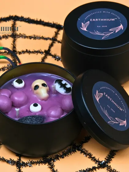 The purple version of my spooky Halloween tin candle.