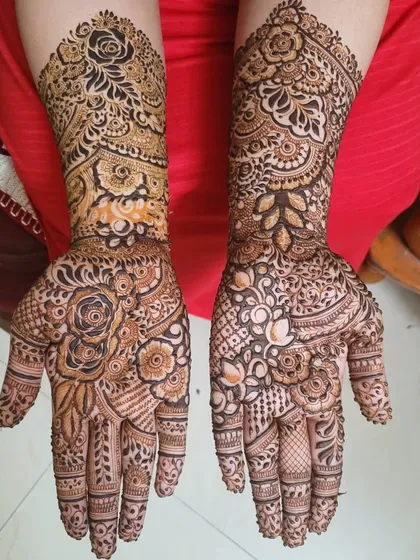 For those who love a full, rich design, I enjoy creating hyper-detailed floral patterns. This piece was a wonderful challenge, layering different flowers and textures to cover the hands and arms completely.
