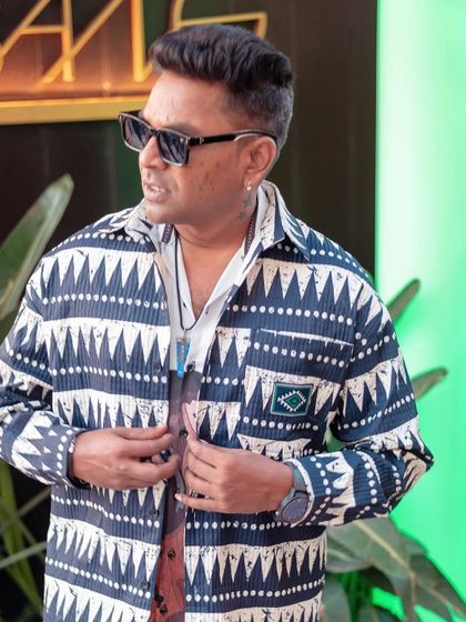 A pre-gig shot in a cool printed shirt for a tribal-themed party. The right look helps set the tone for the night.