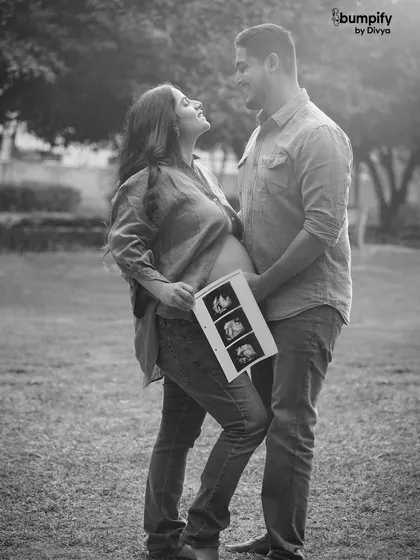 Laughter and joy captured in black and white. This candid shot of the couple sharing a happy moment with their sonogram is absolutely priceless.