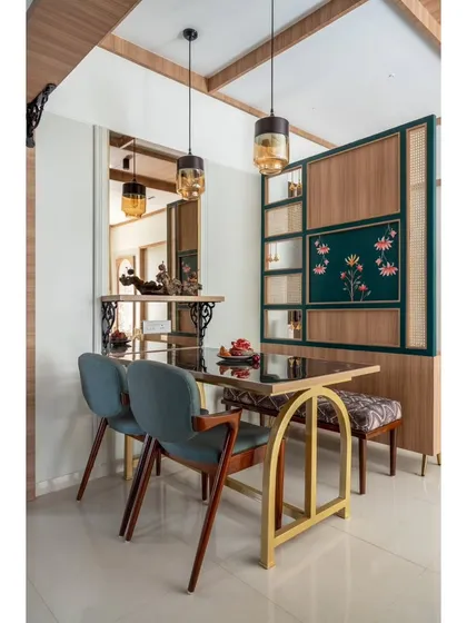 A beautifully composed dining area featuring a mix of chairs and a bench for flexible seating. The hand-painted panel and pendant lights make this a unique and inviting space to gather.