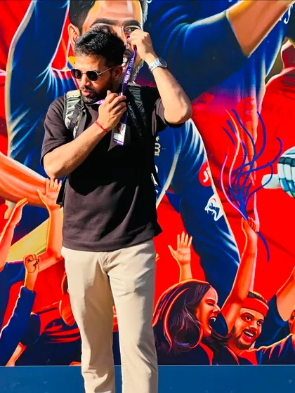 In front of a mural celebrating the fans. The energy of the crowd is a huge part of the game, and we train to thrive in that high-pressure environment.