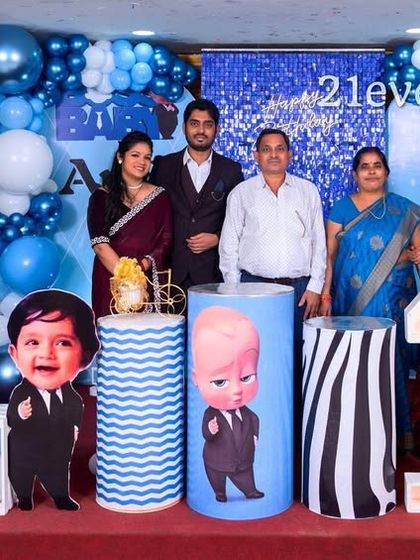 The whole family celebrating a Boss Baby themed first birthday.