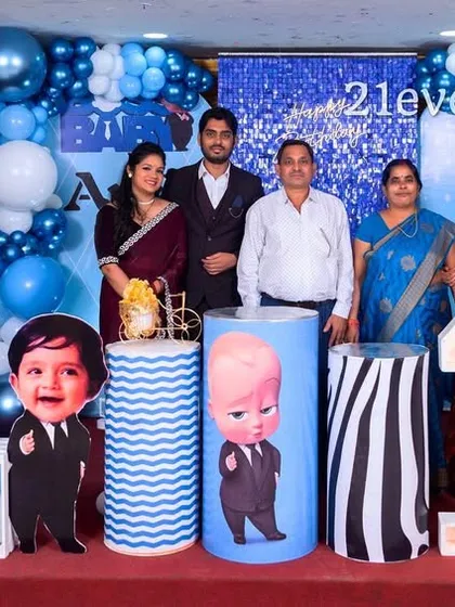 The whole family celebrating a Boss Baby themed first birthday.