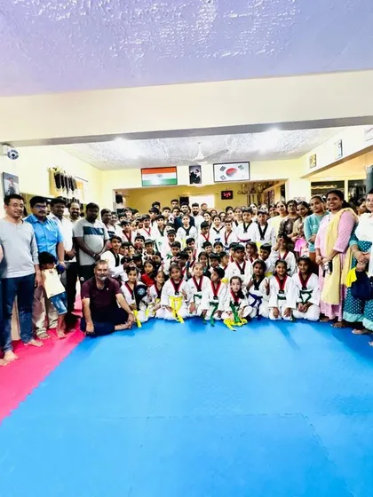 Another great photo with the parents and students, capturing the community spirit of our dojang.