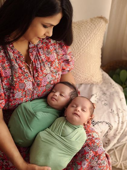 A beautiful moment between a mother and her newborn twins. I make sure to capture these quiet, loving interactions during our family portrait sessions.