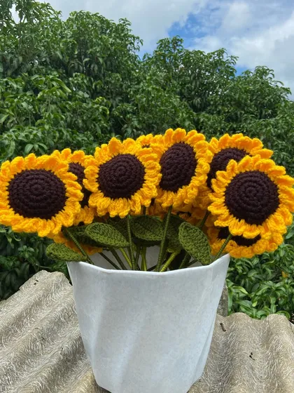 A classic sunflower bouquet arranged in a white vase, perfect for home decor.