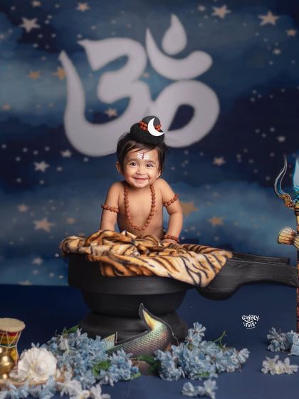 A smiling baby Shiva, looking absolutely adorable in our Shivratri setup.
