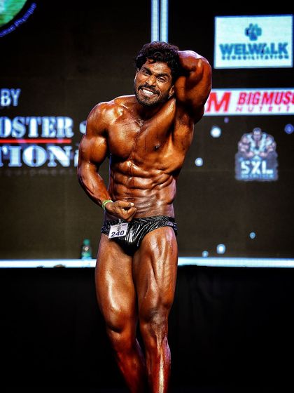 A classic pose on stage at the Naresh Surya Classic. The smile shows the confidence that comes from being perfectly prepared.