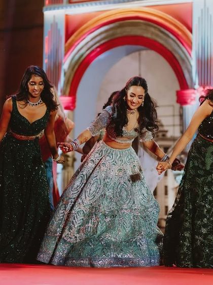 The bride and her bridesmaids in a beautiful, flowing formation. The choreography was designed to look like a scene straight out of a Bollywood movie.