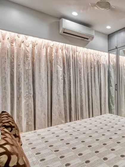 We pay attention to every detail, including lighting and window treatments. The concealed lighting above the curtains adds a soft, ambient glow to the bedroom.