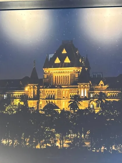 The Bombay High Court illuminated at night. The pursuit of justice is a round-the-clock commitment.