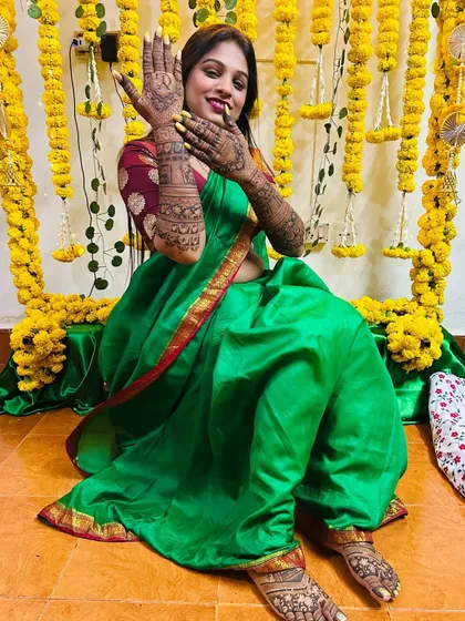 Another shot of the bride's full mehndi, with a clear view of her intricate foot design. The patterns are dense and traditional, perfect for a classic bridal look.