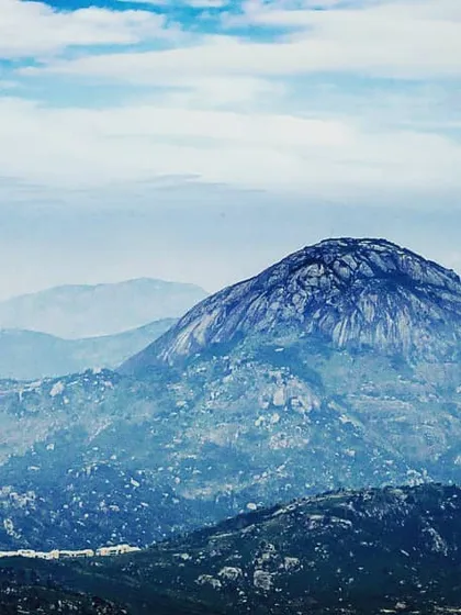 Another perspective of Nandi Hills, with a slightly different color treatment to create a cooler, more atmospheric feel. The building at the base gives a sense of scale to the massive rock formation.