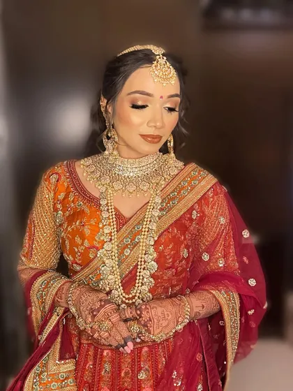 A close-up showcasing the detailed eye makeup for Purva, with a blend of gold and bronze shadows to create a captivating look.