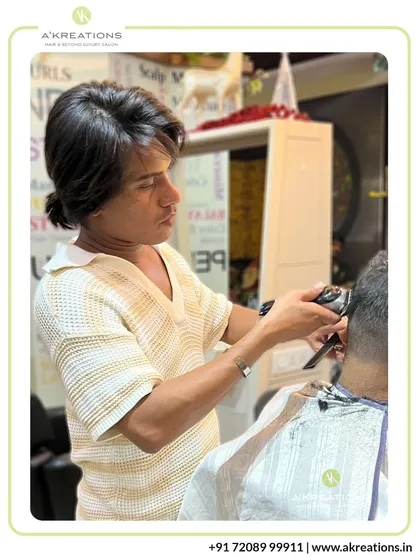 Salon Art Director Rayban Khan uses clippers with precision to execute a clean fade, a fundamental skill for modern men's grooming.