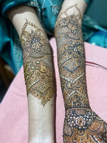A side-by-side comparison of the front and back of the arms for a single client. This shows how the design wraps completely around, offering beauty from every angle.