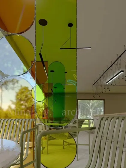A close-up of the layered, colored glass panels. These elements are strategically placed to divide the space visually without blocking light, making the interior feel larger and more dynamic.