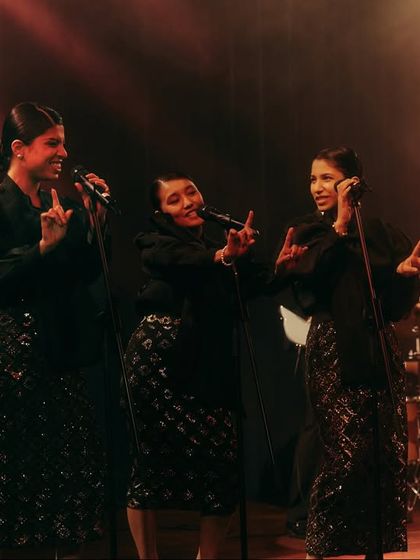 The backup singers for the jazz band, styled in coordinated black sequined outfits to look like a classic trio. Every detail in casting and styling helps build the authenticity of the scene.