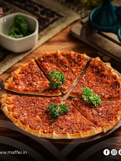 Our Spiced Mixed Veggie Manakeesh is a vibrant and healthy choice, topped with a savory mix of finely chopped vegetables and spices.