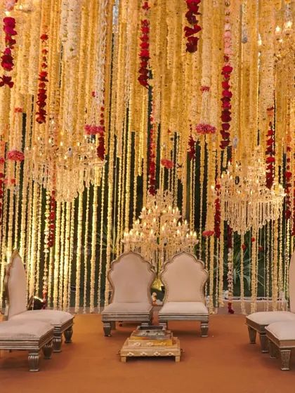 We believe in timeless elegance. This mandap setting combines the grandeur of cascading floral chandeliers with traditional seating, creating a space that feels both royal and deeply rooted in heritage.