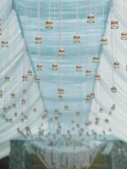 A detail shot of the hanging bells from the Anand Karaj ceremony ceiling. This subtle, traditional element added a delicate and meaningful touch to the overall design.