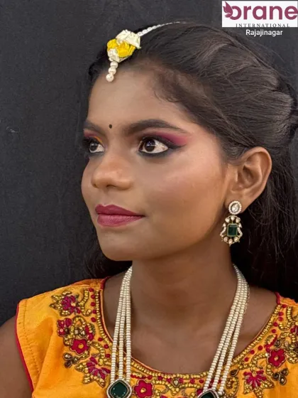 A beautiful profile shot showcasing the complete Haldi look with floral jewelry.