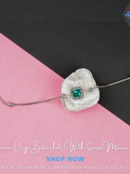 This delicate bracelet features a square green onyx stone and Swiss marcasites on a fine silver chain.
