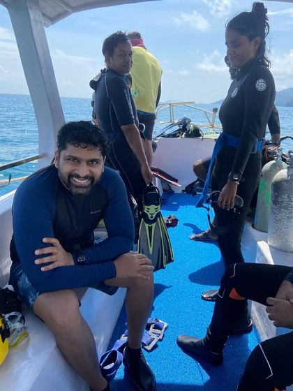 A smiling diver on the boat in the Andamans. The joy of diving is evident.