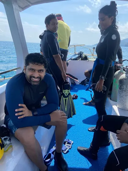 A smiling diver on the boat in the Andamans. The joy of diving is evident.