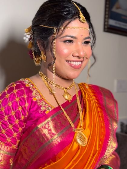 A radiant smile from my beautiful Marathi bride. The makeup was kept natural and glowing to complement the vibrant colors of her Paithani saree.