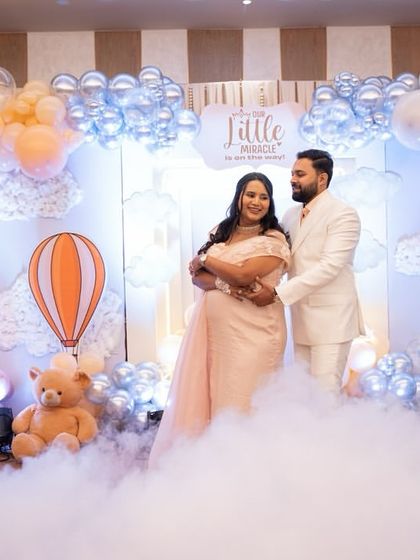 To create a truly magical atmosphere, I used dry ice to make it look like the parents-to-be were floating on clouds. It’s a special effect that adds a touch of wonder to the 'Up, Up & Away' theme.