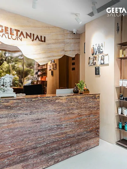 A look inside our new Shilp Shivalik salon in Ahmedabad. The reception area features natural stone and wood textures, creating a serene and earthy atmosphere.