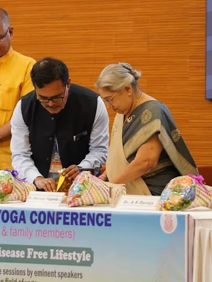 Interacting with fellow speakers and organizers at the DAE National Yoga Conference. Sharing knowledge and building connections are key to spreading the message of holistic health.