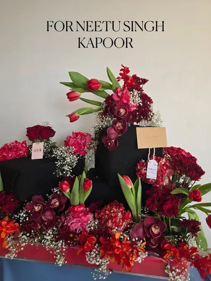 I designed this magnificent arrangement of deep red roses, tulips, and orchids for the wonderful Neetu Singh Kapoor. The goal was to create something dramatic and full of love, with layers of different textures and shades of red.
