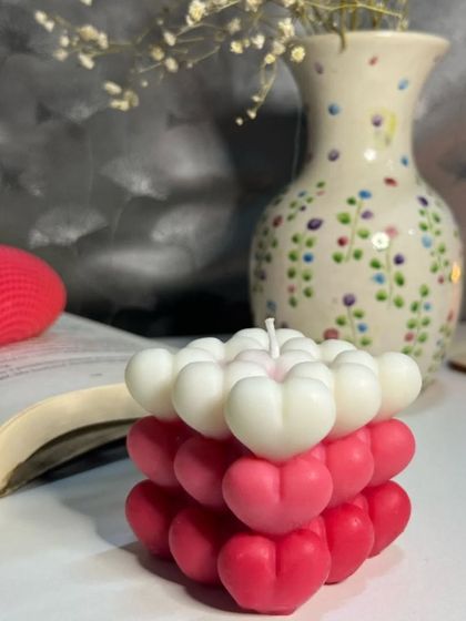 This shot highlights the unique ombre effect on our heart bubble candle. The gradual shift in color from white to deep pink makes each hand-poured candle a one-of-a-kind piece of art.