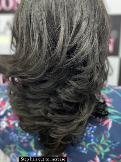 A close-up of a step haircut, designed specifically to increase the appearance of volume and thickness in the hair.