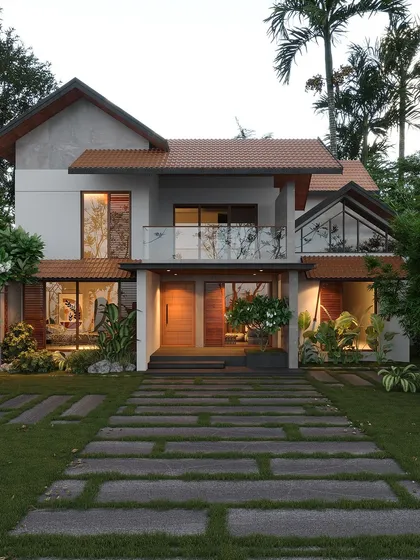 A prime example of my tropical fusion style, this home combines traditional sloped terracotta roofs with modern, large-format glass windows. The design ensures the home feels both contemporary and deeply rooted in Kerala's architectural heritage.