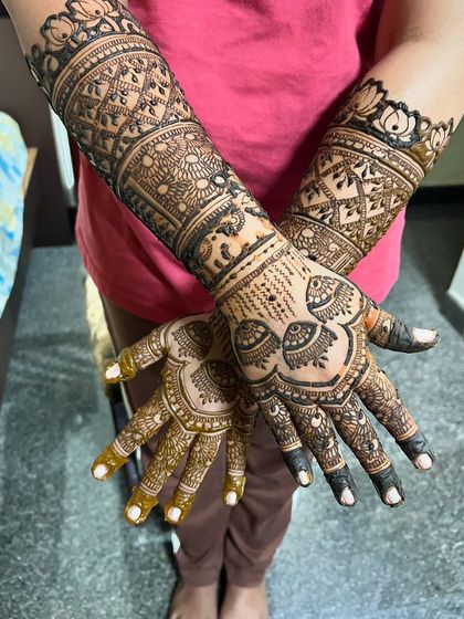 An engagement design with a beautiful mix of patterns, including jhumkas and elephants.