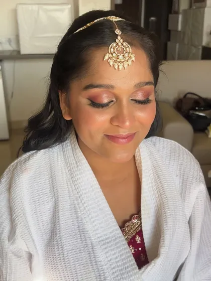 A close-up of the eye makeup, featuring soft pink tones and a subtle shimmer. This look is perfect for a bridesmaid who wants to look elegant and romantic.