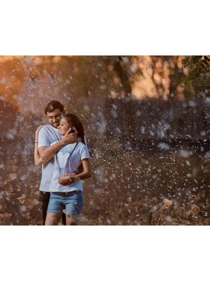 A dynamic and fun shot from Mayank and Riddhi's pre-wedding shoot. Using elements like these flying particles adds a magical and cinematic feel to your photos.