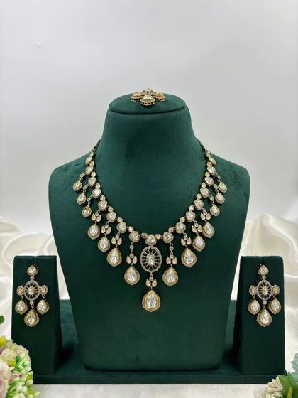 The same necklace design with green stones.