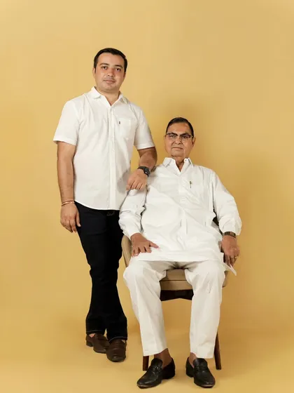 A strong and simple portrait of a father and his adult son. Family portraits are not just for young children; they are for every stage of life.
